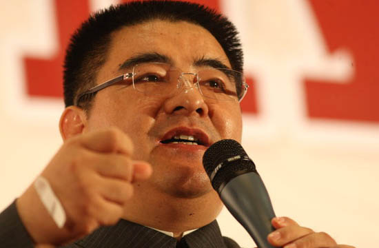 Chinese businessman talks at a summit forum in Shandong