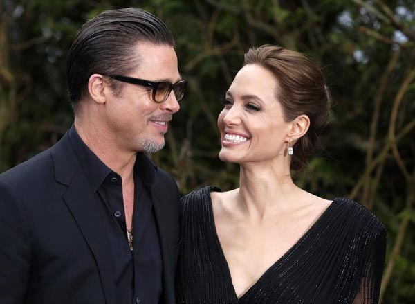 Quietly, Brad Pitt and Angelina Jolie say, 'I do'