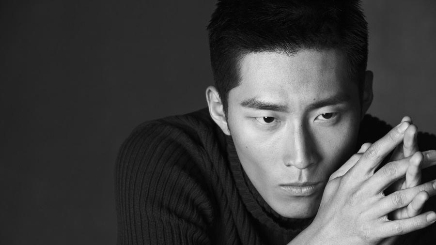 Actor Dou Xiao in black and white