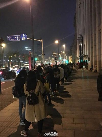 Fans line up in Shanghai to pose with postbox touched by pop star