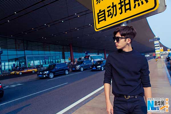 Actor Jing Boran poses in all-black