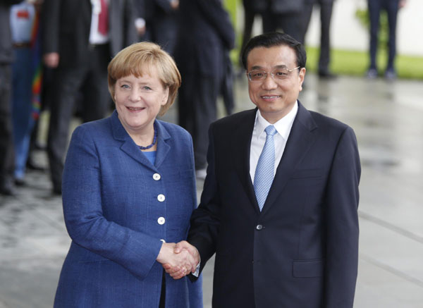 Li attends welcoming ceremony held by Merkel