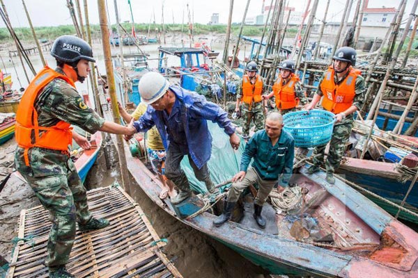 Typhoon Chan-Hom causes flooding, power cuts and panic buying