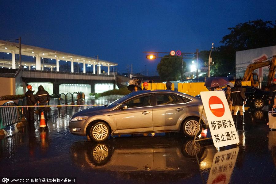 Family wades across flood to catch train