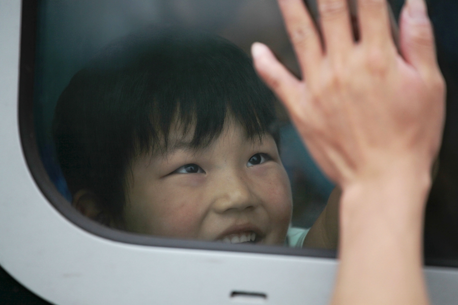 Goodbyes and tears as left-behind children head home