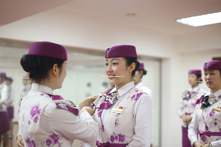 Stewardesses trained to show sweet smile