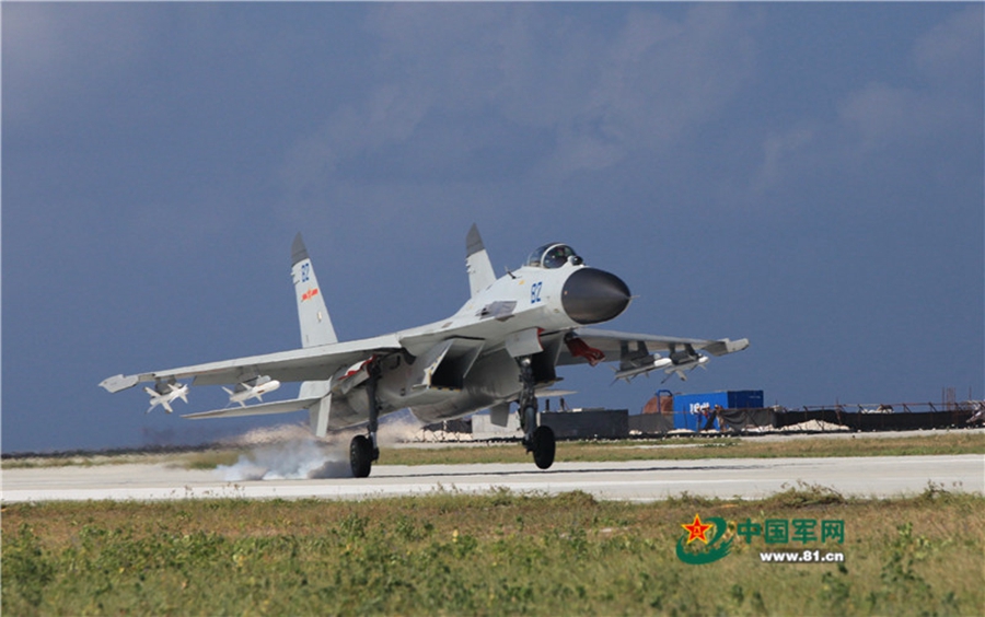 Naval aviation J-11 fighters conduct flight training