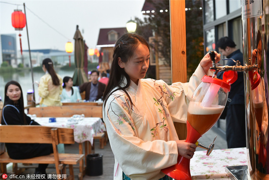 Restaurant employees serve history in traditional costumes