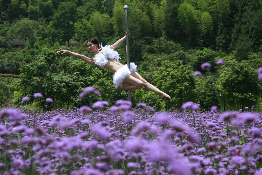 Pole dancing in sea of flowers