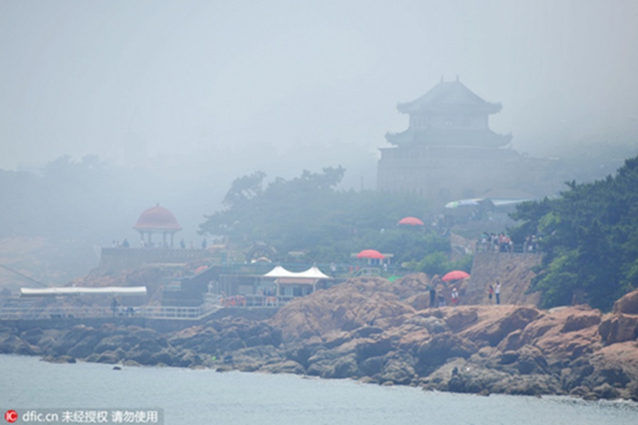 Rising above the clouds: Mist envelops Qingdao