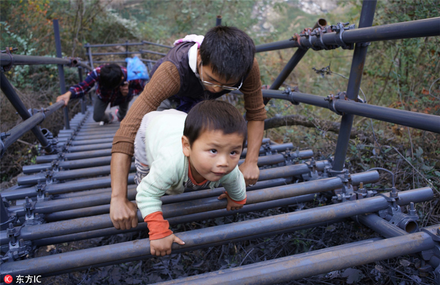 Steel ladder opens safer path for cliff village children