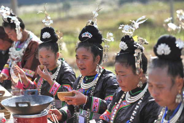 Dong people eat at world's longest feast table