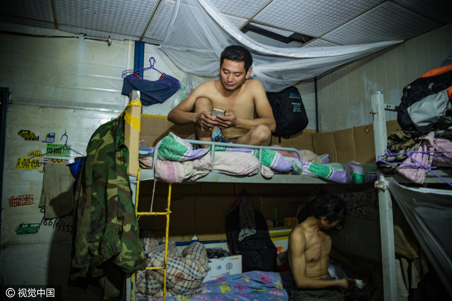 Workers behind Beijing's tallest building