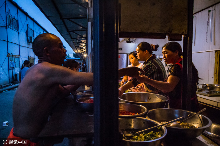 Workers behind Beijing's tallest building