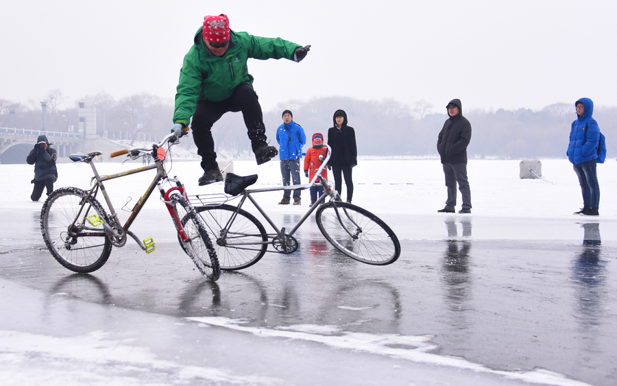 55-year-old man performs bicycle stunts on ice