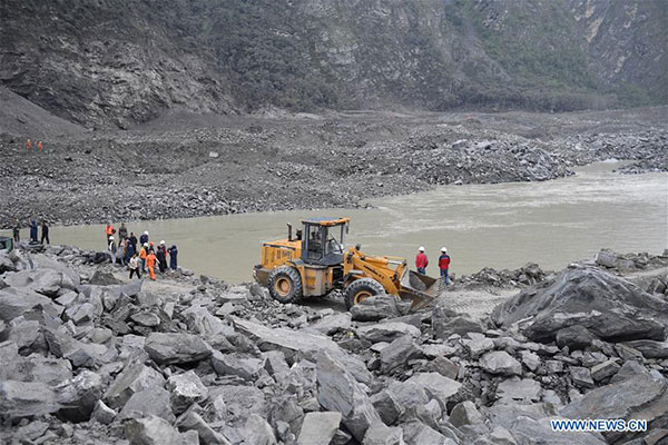 15 found dead in SW China landslide burying 120