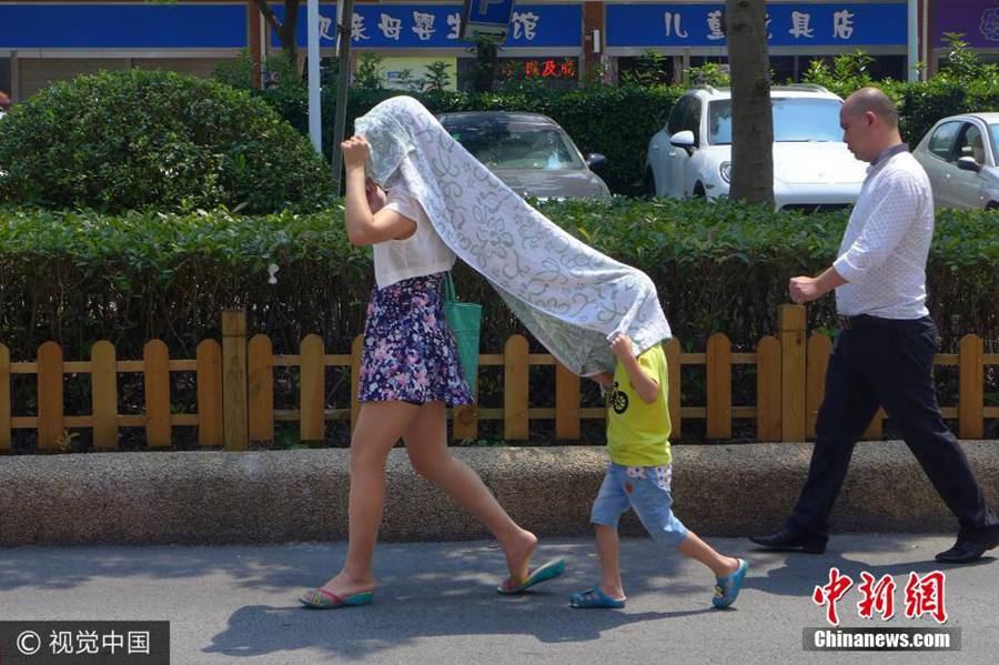 Anything goes as a hat in China's hot summers