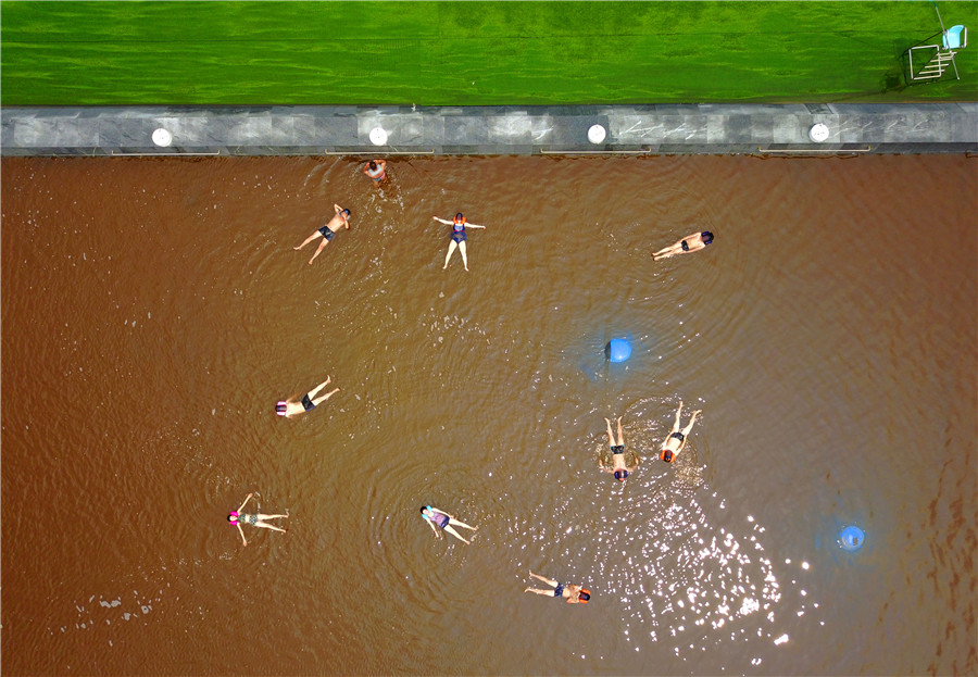 Swimmers float in 'Dead Sea' in Dalian