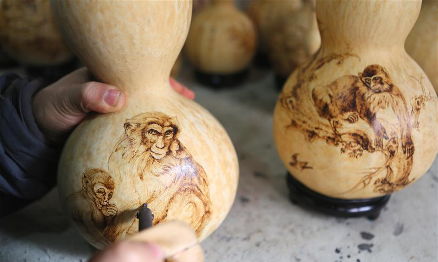 Folk artist makes handicrafts themed Monkey King to greet lunar year