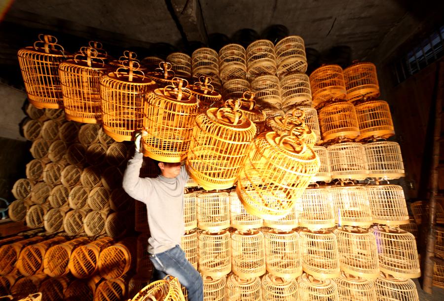 Hand-made birdcage family workshop in China's Guangxi