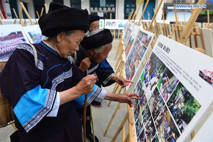 Photo exhibition on customs, life of villagers held in SW China