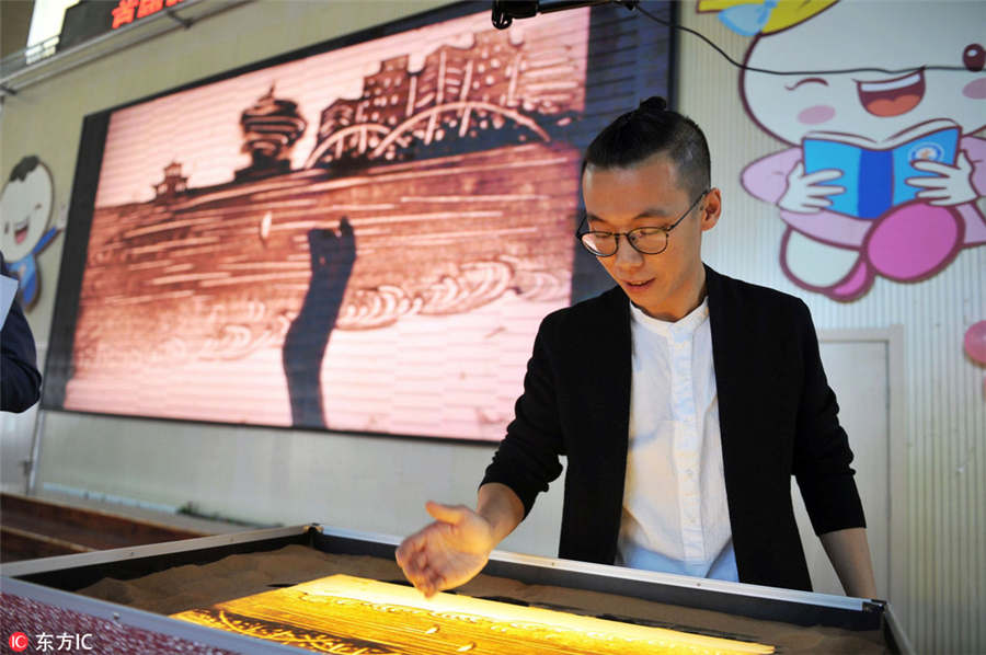 Qingdao students show talents at sand art festival