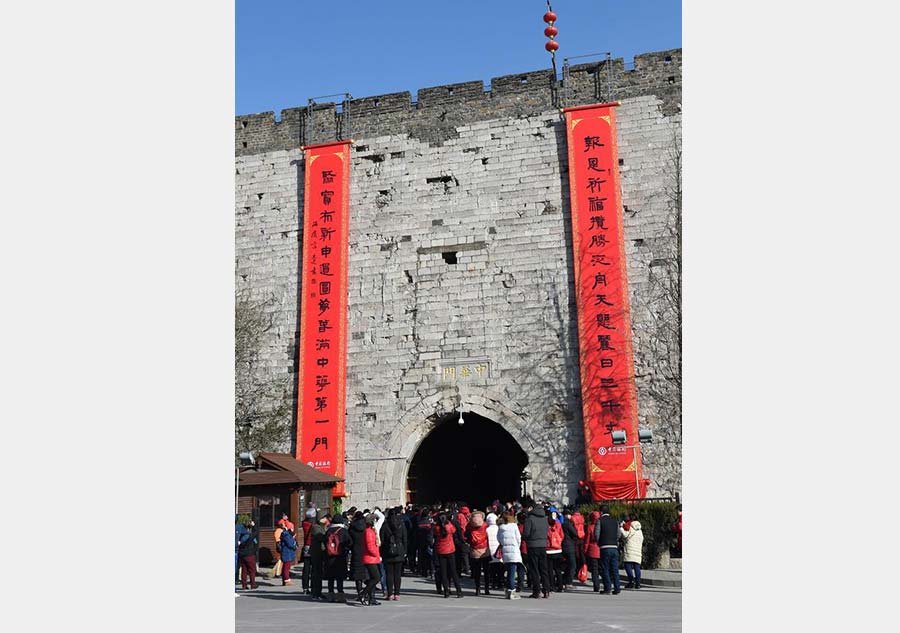 Spring Festival couplets flank gate on Nanjing city wall