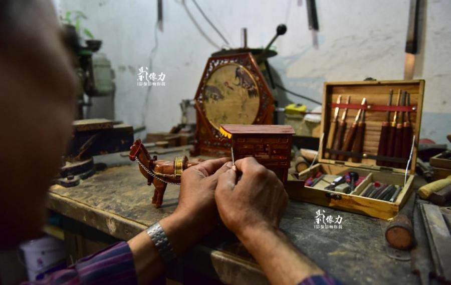 Retiree spends nearly three years carving iconic railway station