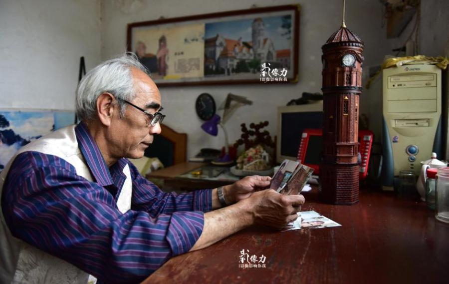 Retiree spends nearly three years carving iconic railway station