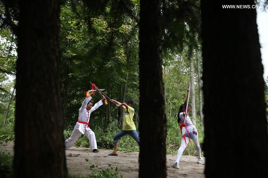 Children learn about Chinese Wushu during summer vacation in SW China