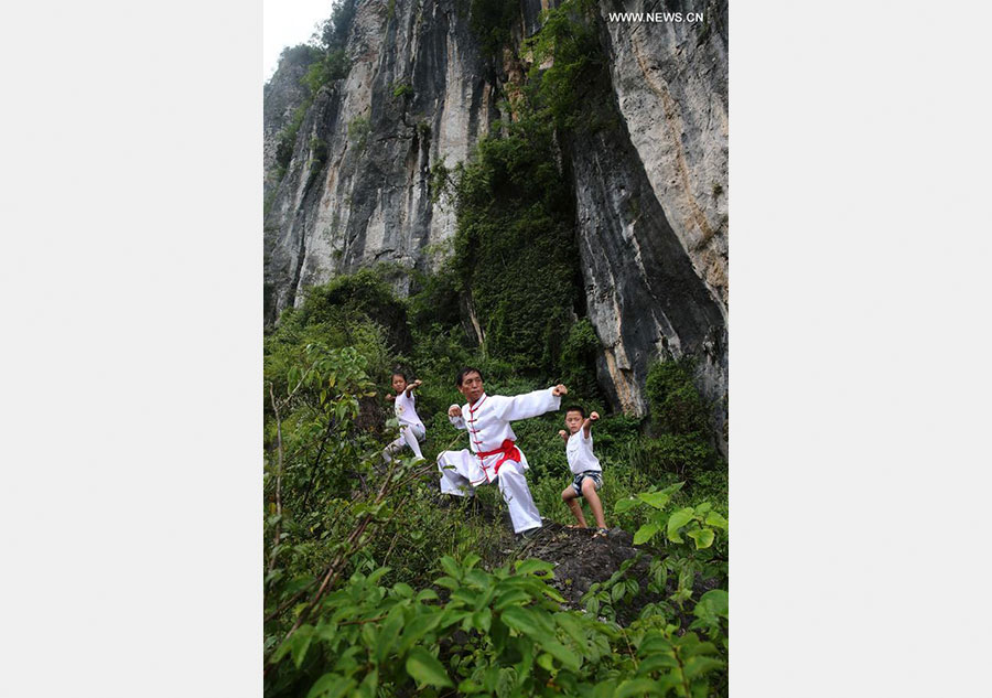 Children learn about Chinese Wushu during summer vacation in SW China