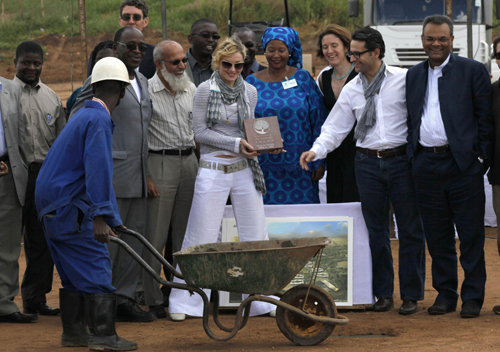 Madonna and her adopted child at site of her Raising Malawi Girls Academy