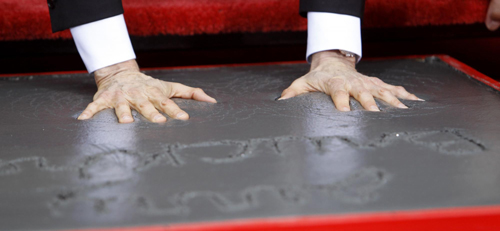 Actors Nicolas Cage and Tom Cruise attend hand and footprints ceremony for producer Jerry Bruckheimer