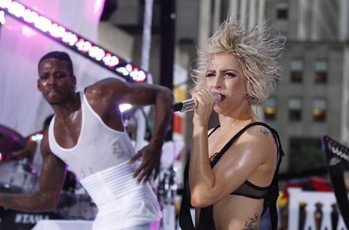 Lady Gaga performs during a rain shower on NBC's 