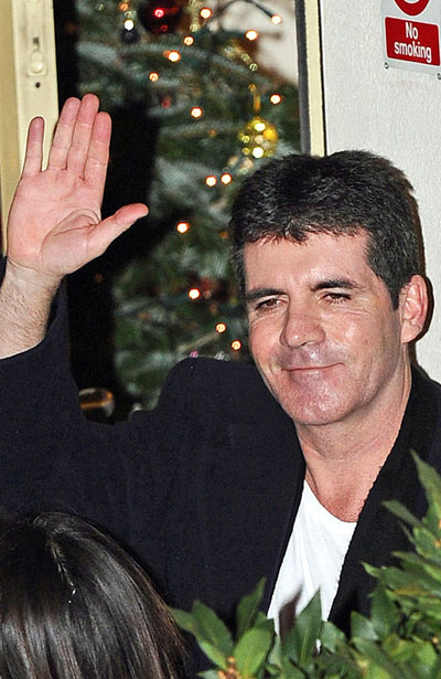 Simon Cowell 'torn' over Cheryl and Nicole