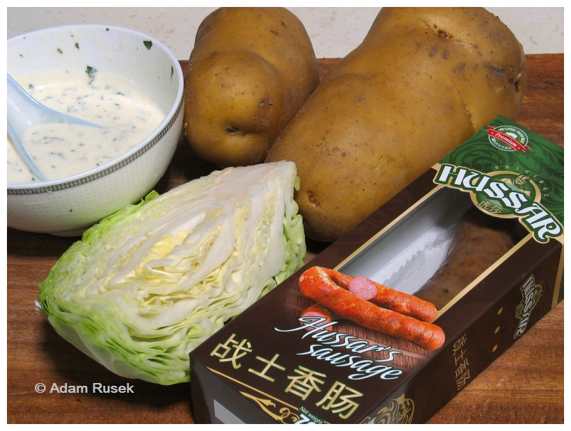 Fried Polish sausage with steamed potatoes and cabbage