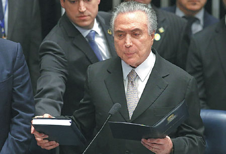 Temer sworn in as new president