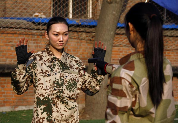 Female bodyguards keep threats at arm's length