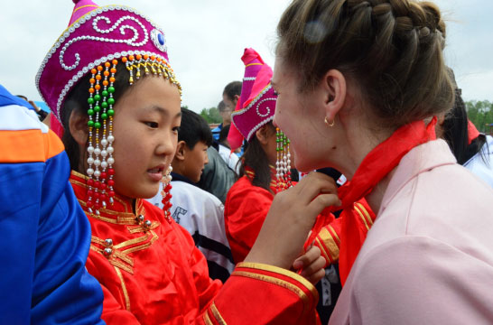 Foreign students volunteering teaching for village students