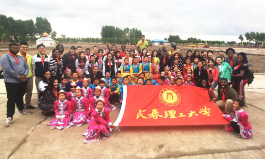 Foreign students volunteering teaching for village students