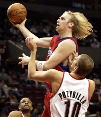 Clippers Kaman drives to basket against Trail Blazers in NBA action in Portland 