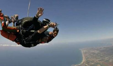 Cuts hair while skydiving