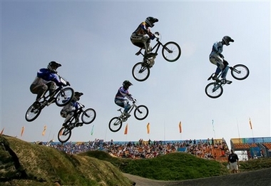 Riders clear a jump during a semi-final at the UCI BMX Supercross World Cup at Laoshan Bicycle Moto Cross (BMX) venue in Beijing August 21,2007. The race is one of 26 test events being held at the venues which will be used for the 2008 Olympic Games.[AP]