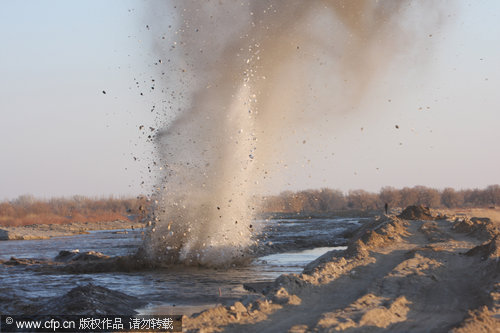 Blowing up ice to help river flow