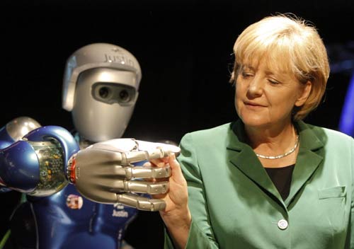 Merkel greets robot at Air Show