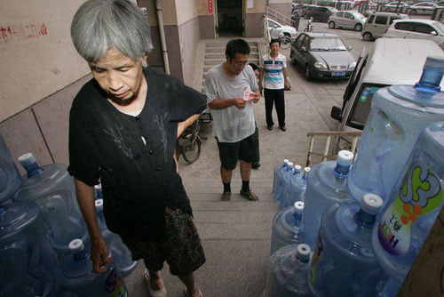 Woman in her 70s delivers water to support family