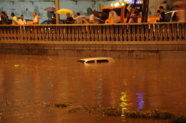 Beijing drenched in downpour