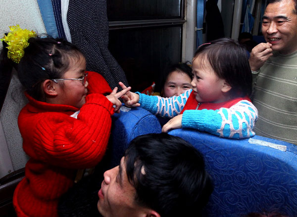 Smiles aboard homeward bound train