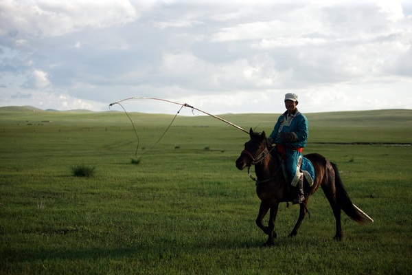 Galloping through prairie in Inner Mongolia