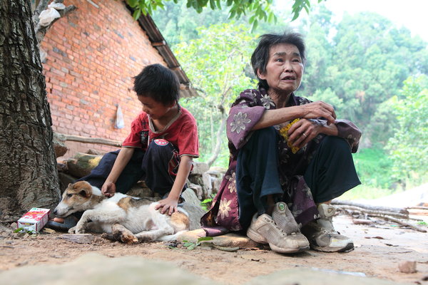 Boy, grandmother, live in isolation in SW China